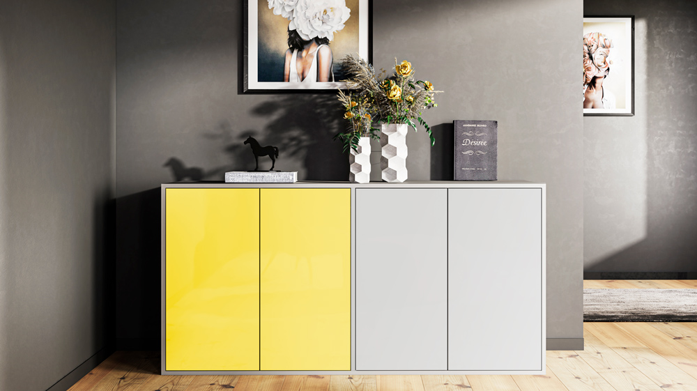 Grau Kommode mit zweifarbigen Fronten in grau und gelb vor einer Wand